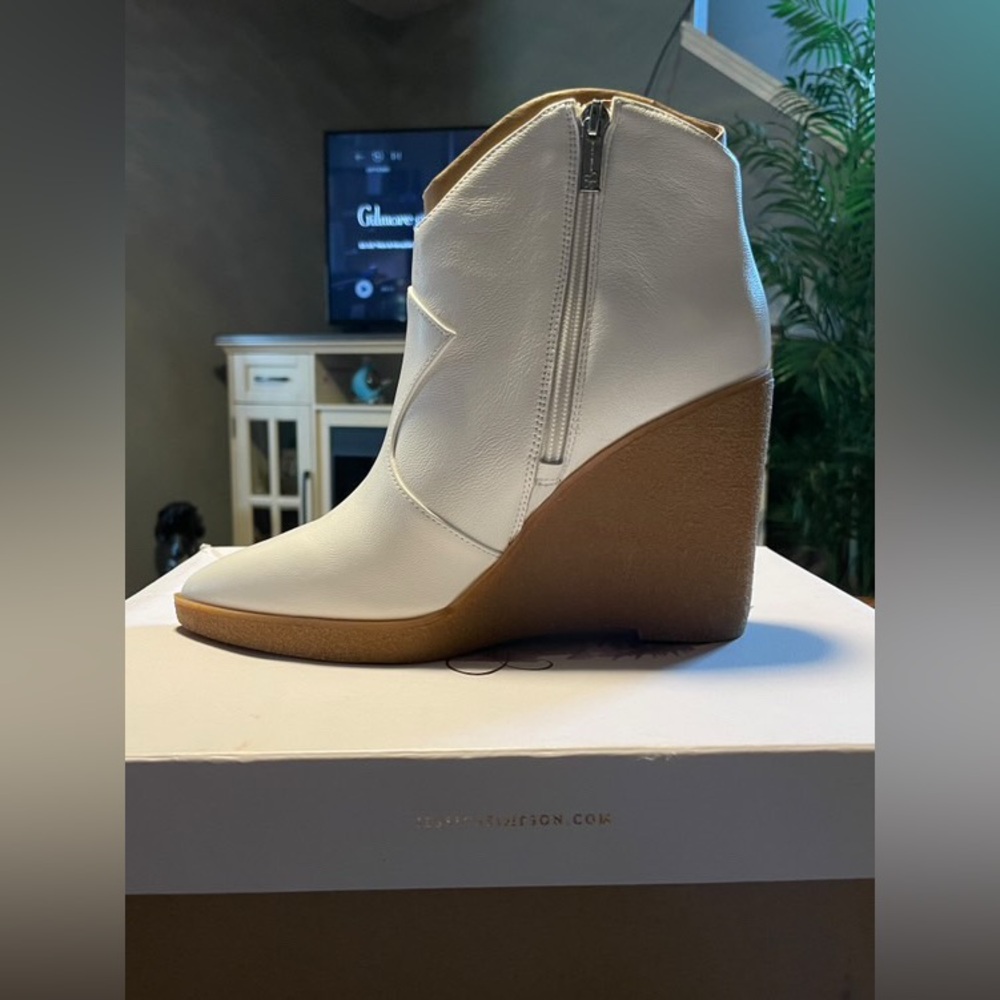 White heeled boots, brand is Jessica Simpson